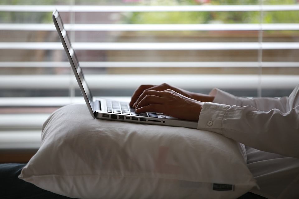 typing on laptop
